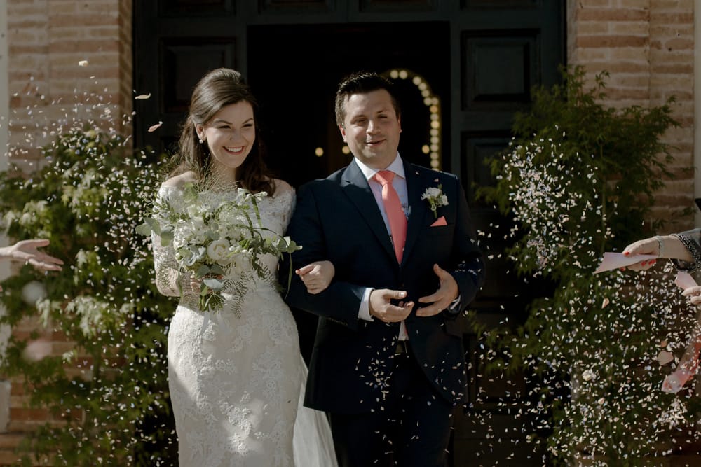 Gemma and Giancarlo walk out of church after their wedding