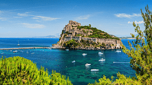 island wedding venue with yachts sailing close