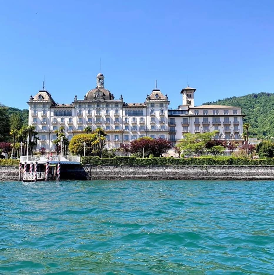 Front view of large Italian palace on shore of Lake Maggiore.
